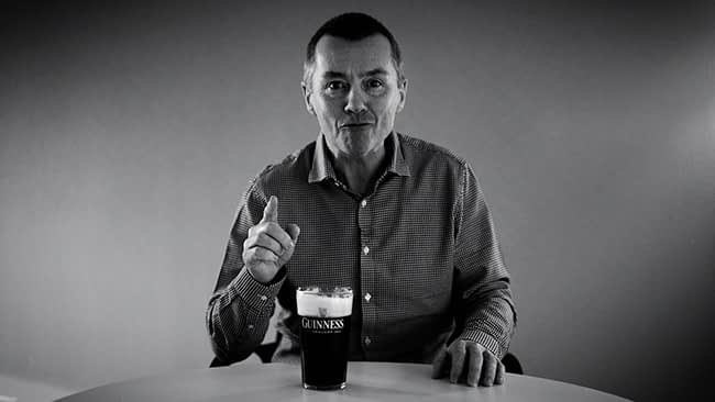 Willie Walsh the CEO of IAG, drinking a Guiness